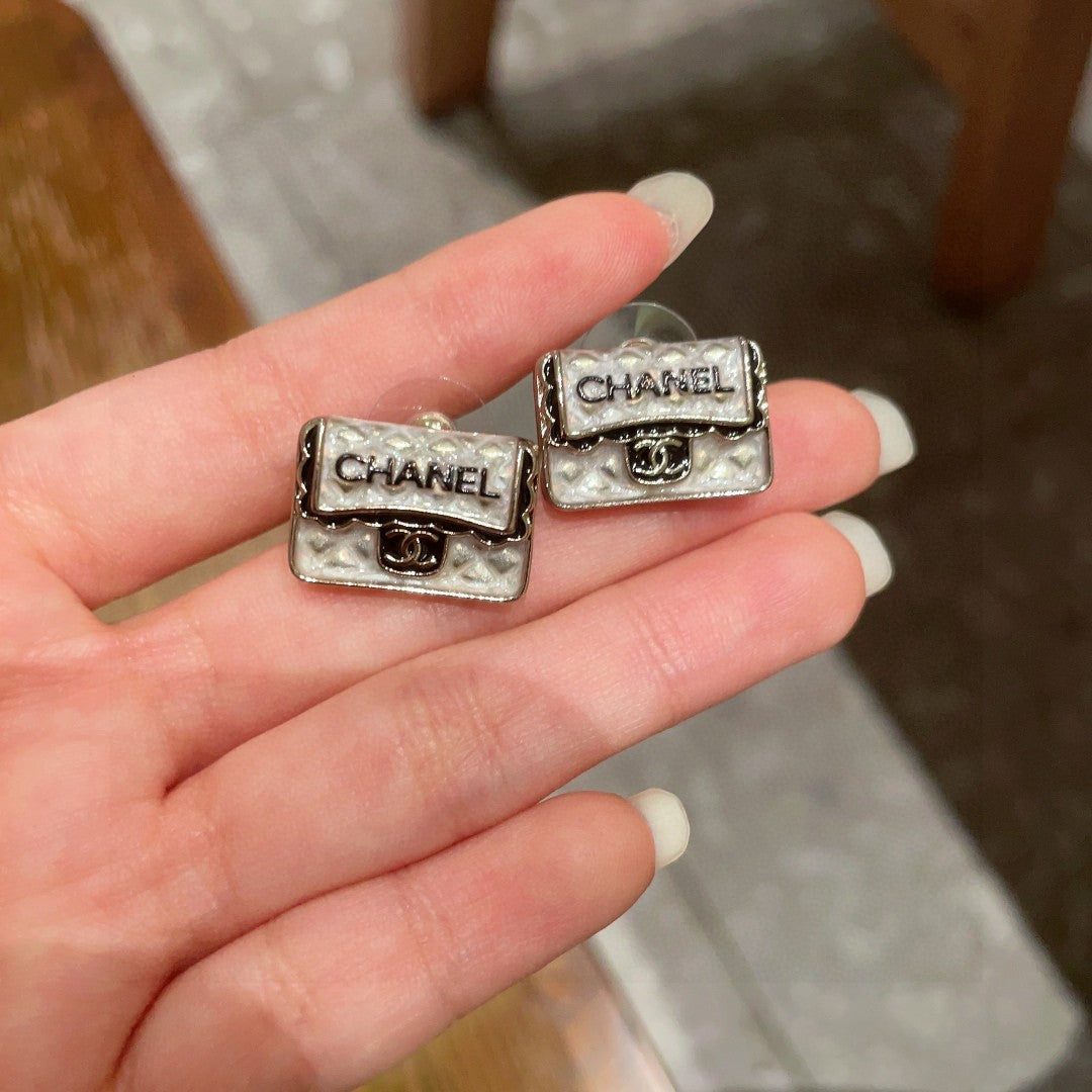 Martin Graham stud earrings in polished metal-tone – side detail