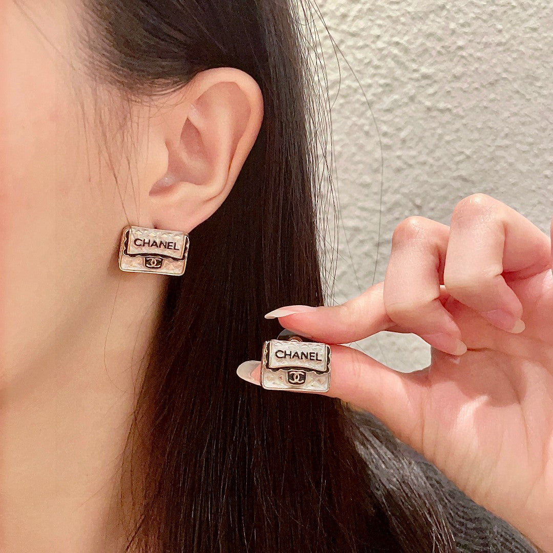 Martin Graham stud earrings in polished metal-tone – main product view