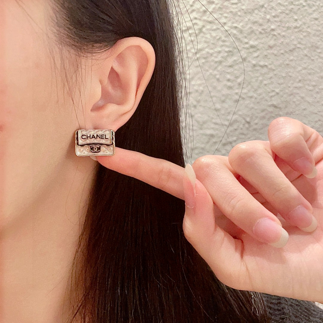 Martin Graham stud earrings in polished metal-tone – front product view