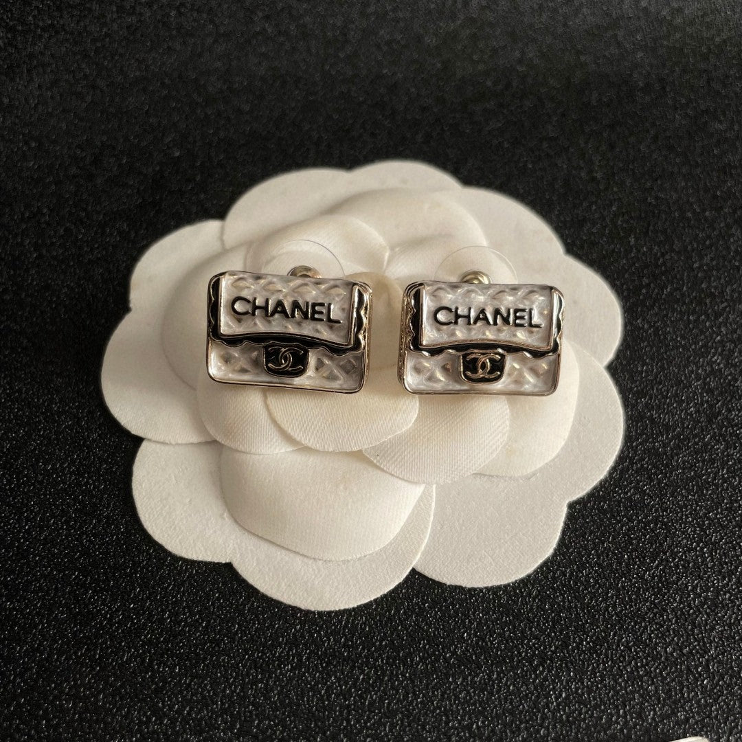 Martin Graham stud earrings in polished metal-tone – front product view