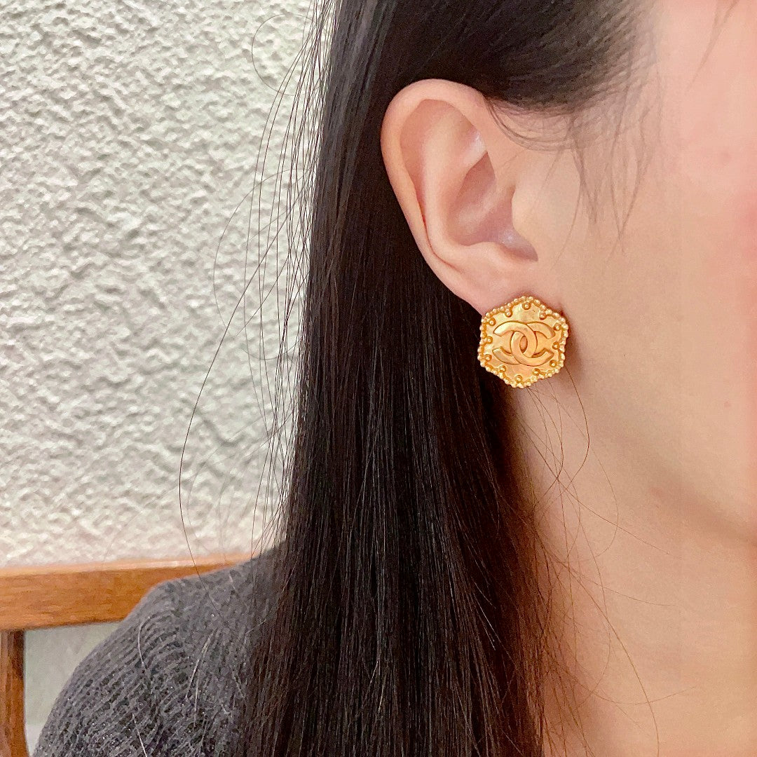 Martin Graham stud earrings in polished metal-tone – detail view
