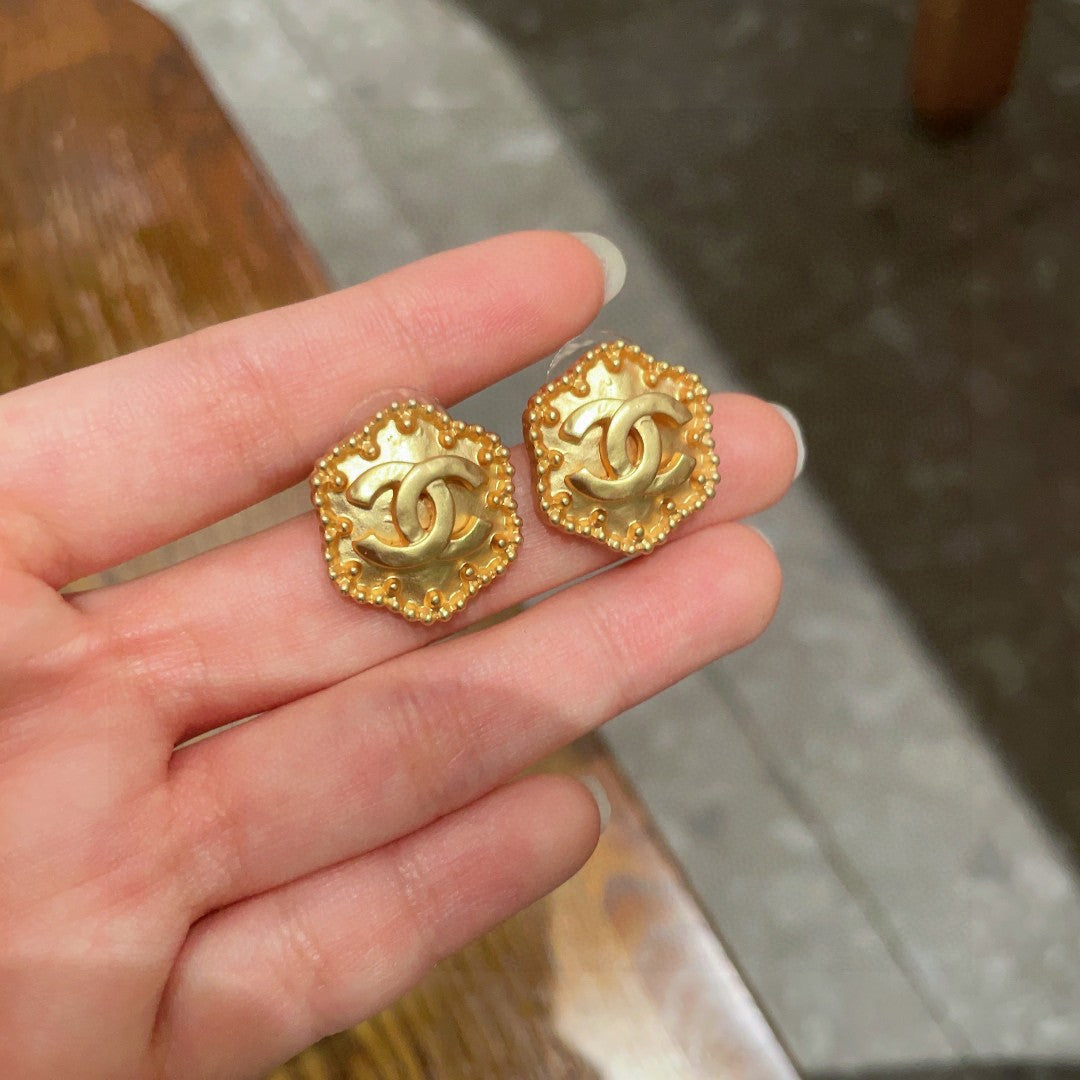 Martin Graham stud earrings in polished metal-tone – side detail