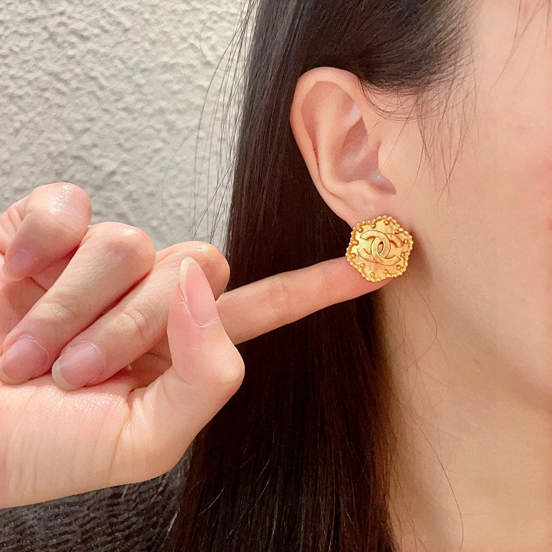 Martin Graham stud earrings in polished metal-tone – front product view