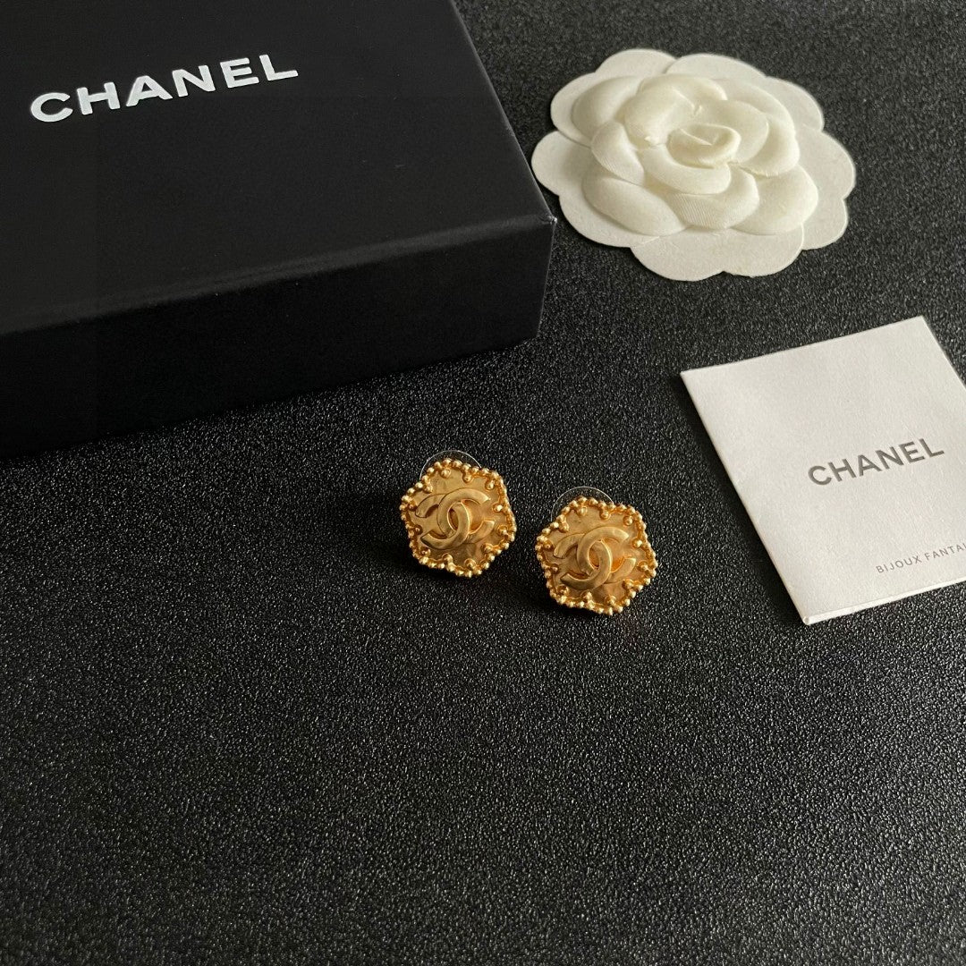 Martin Graham stud earrings in polished metal-tone – styled product view