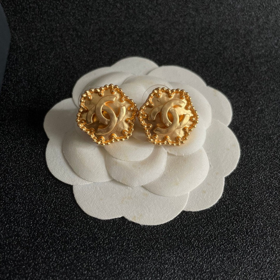 Martin Graham stud earrings in polished metal-tone – front product view