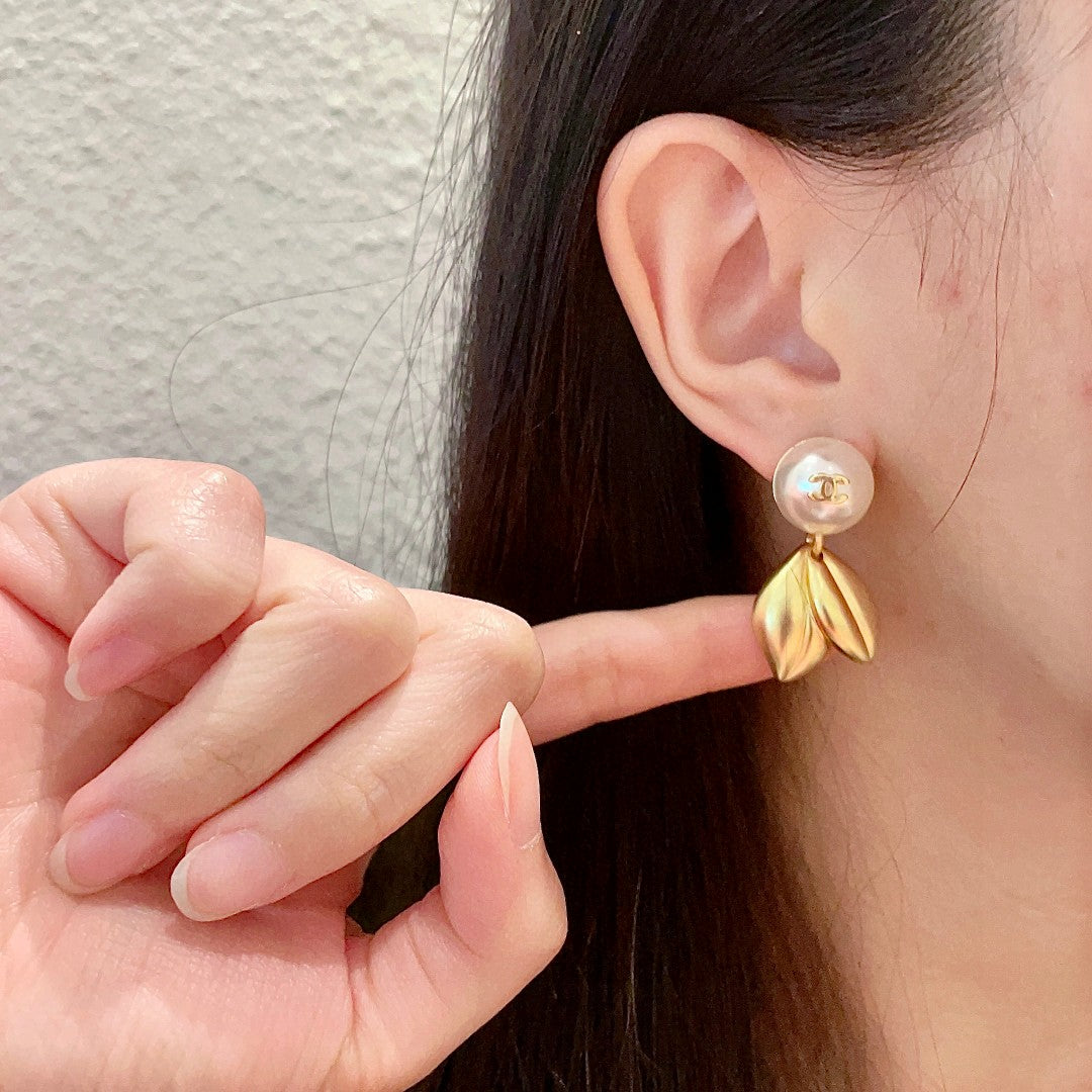 Martin Graham earrings in polished metal-tone – front product view