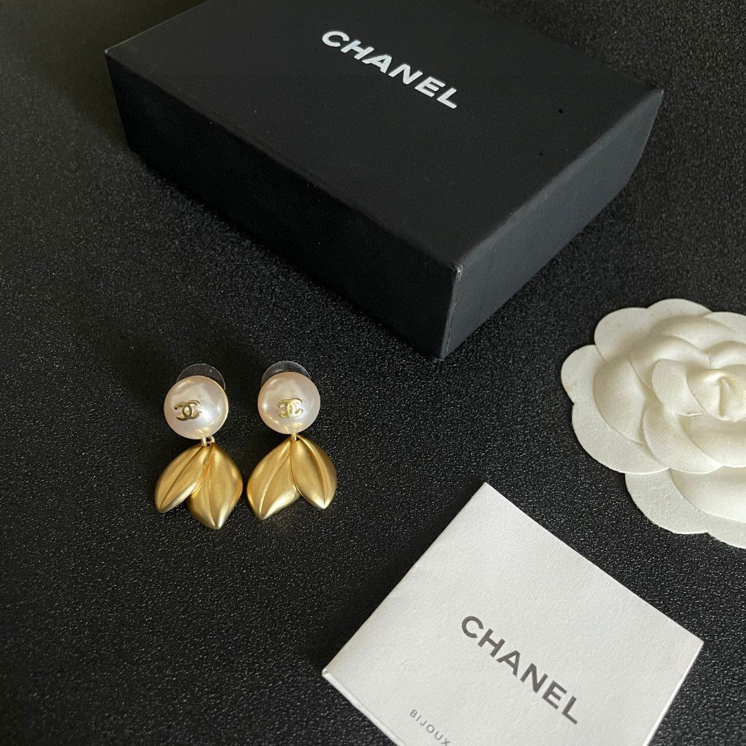 Martin Graham earrings in polished metal-tone – close-up detail