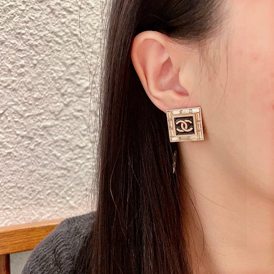 Martin Graham stud earrings in polished metal-tone – detail view