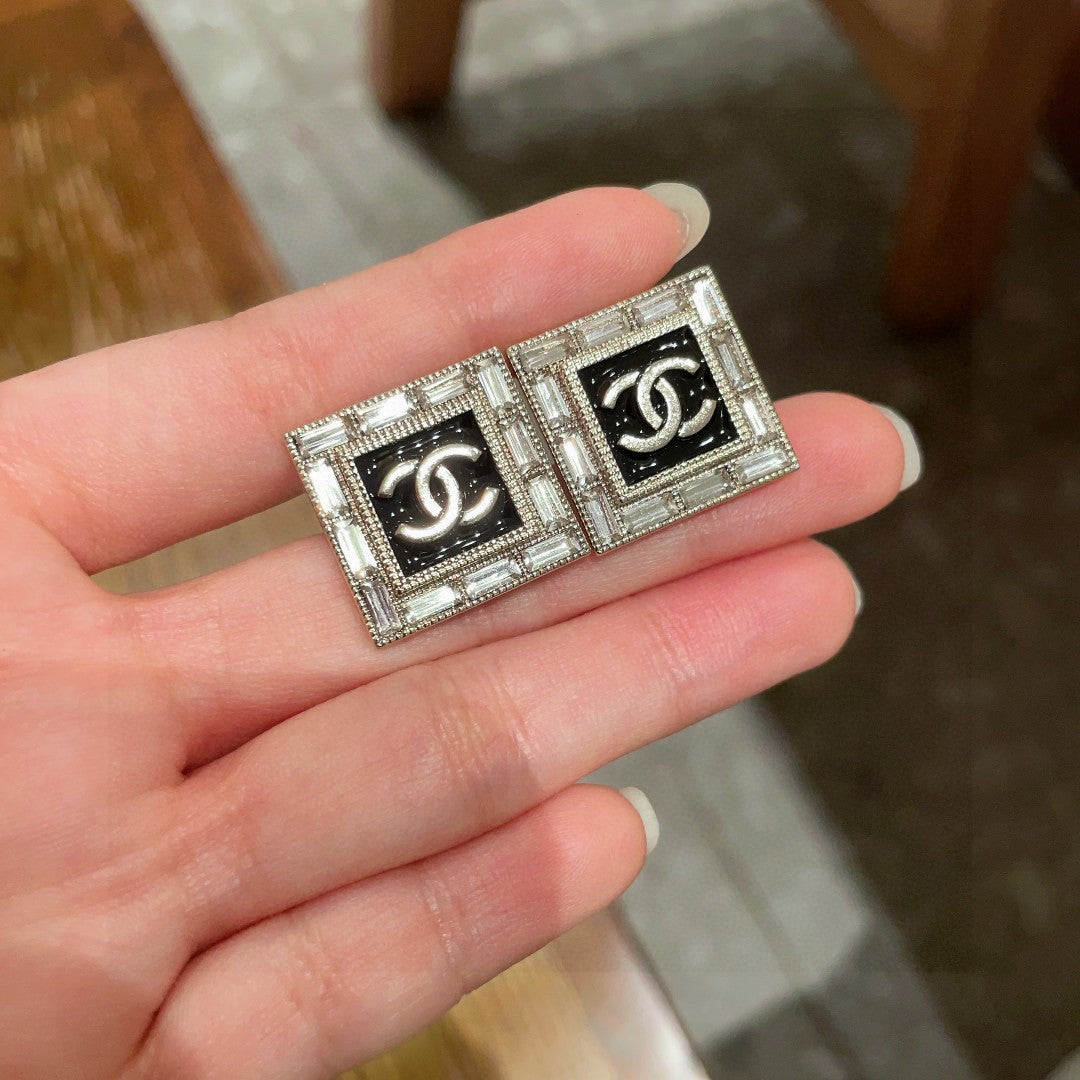 Martin Graham stud earrings in polished metal-tone – side detail