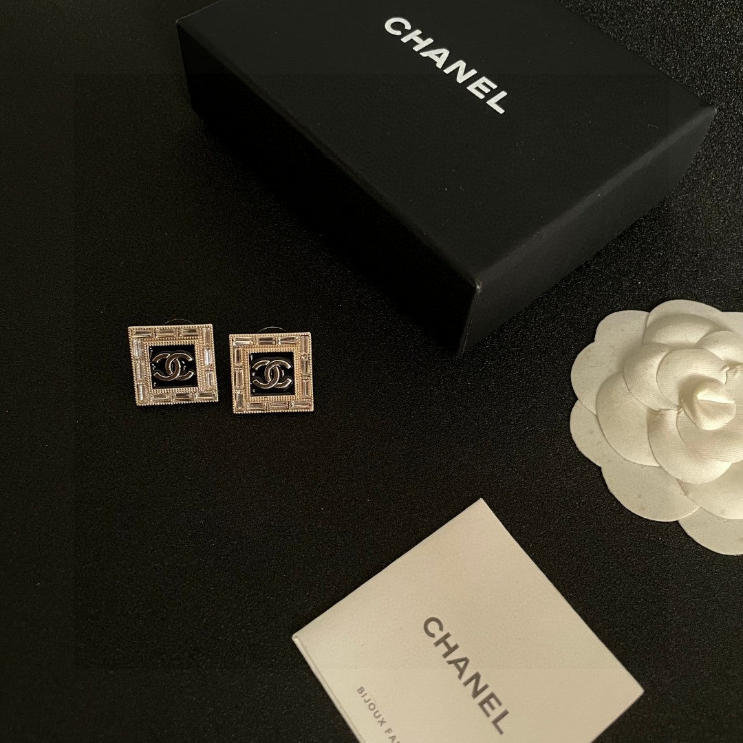Martin Graham stud earrings in polished metal-tone – close-up detail