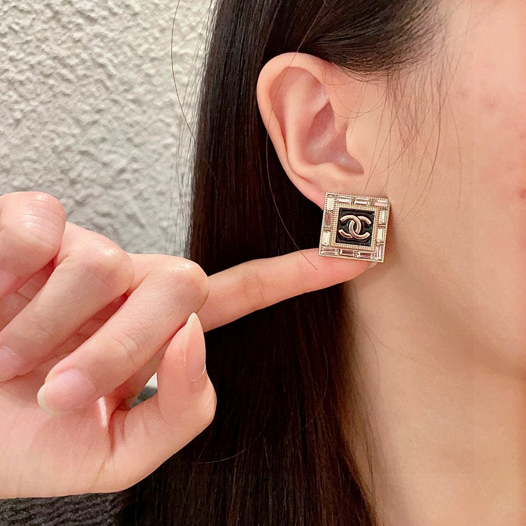Martin Graham stud earrings in polished metal-tone – front product view