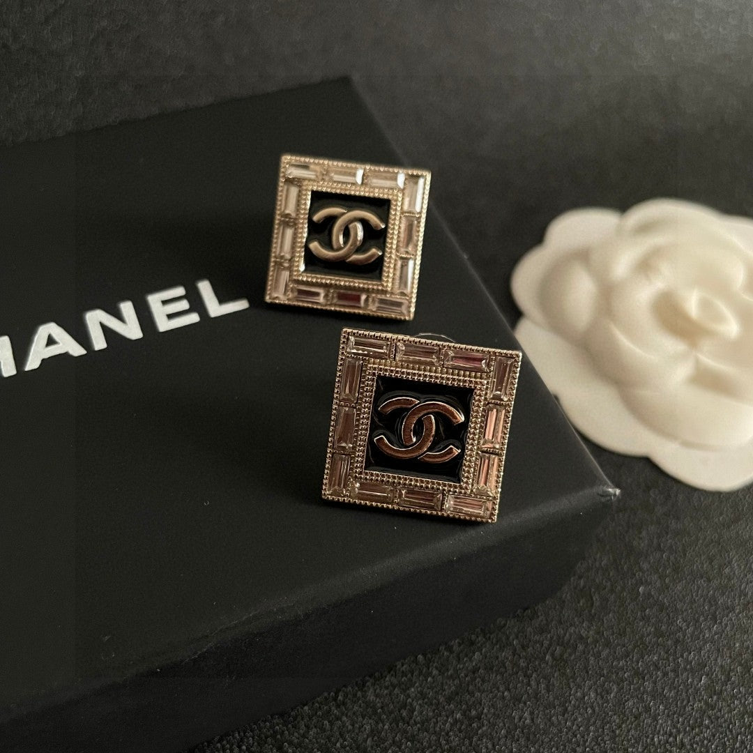 Martin Graham stud earrings in polished metal-tone – detail view