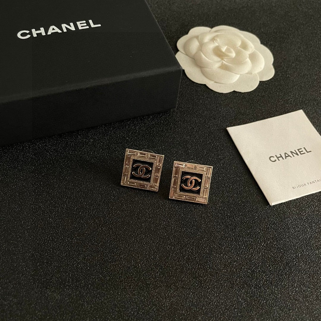 Martin Graham stud earrings in polished metal-tone – styled product view