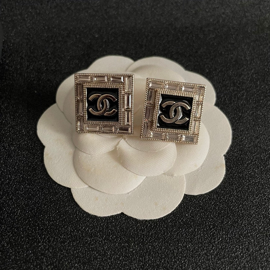 Martin Graham stud earrings in polished metal-tone – front product view