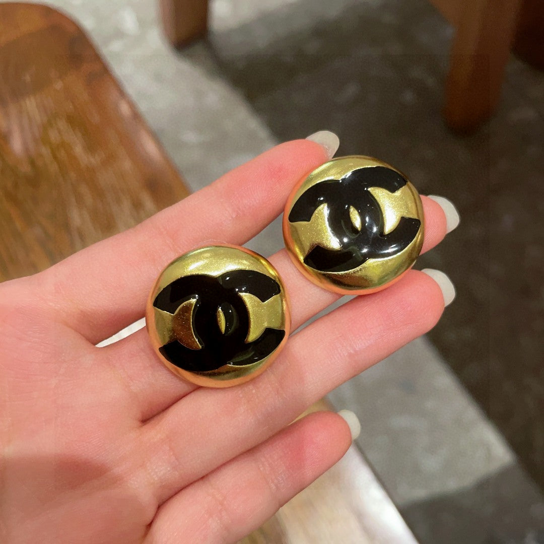 Martin Graham stud earrings in polished metal-tone – side detail