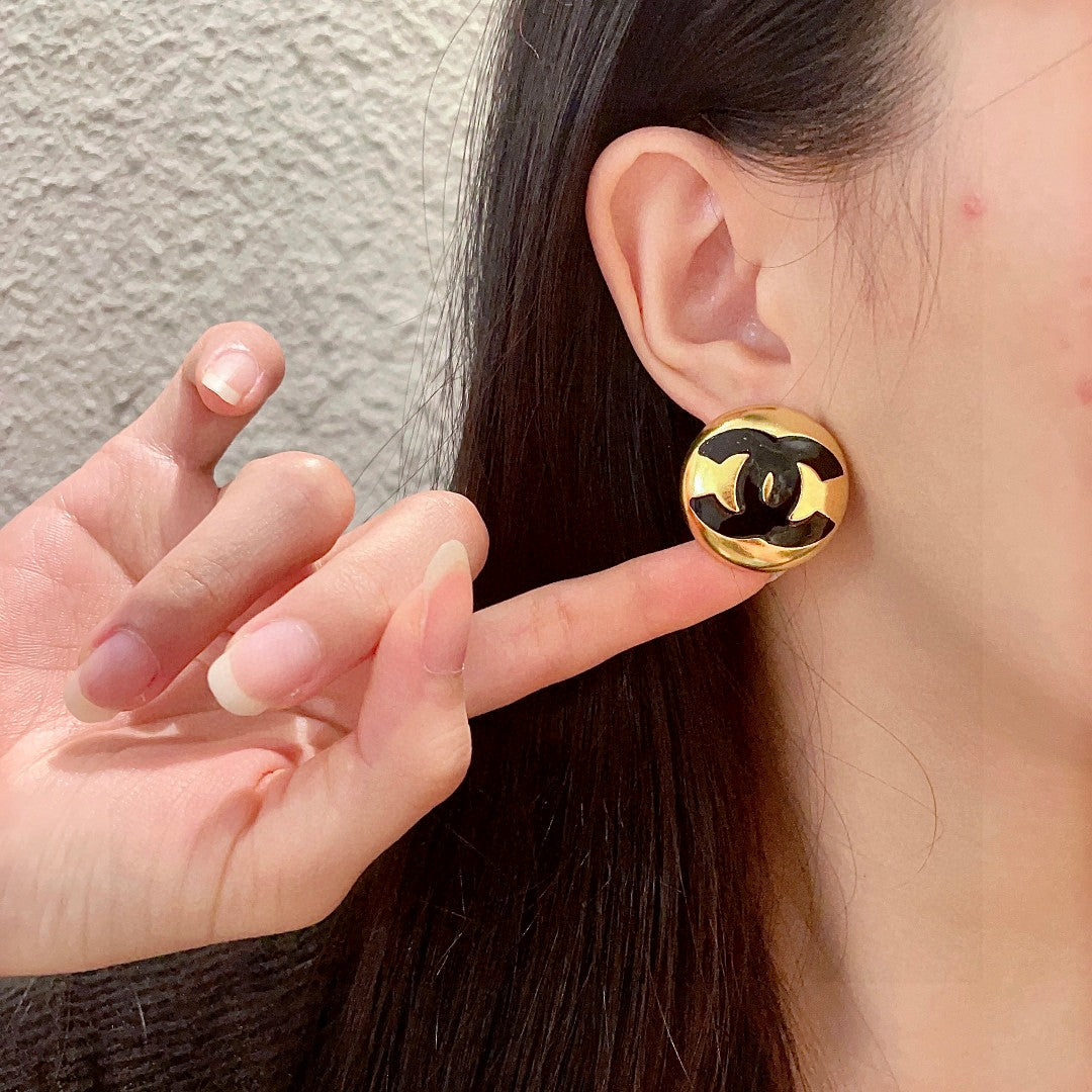 Martin Graham stud earrings in polished metal-tone – front product view