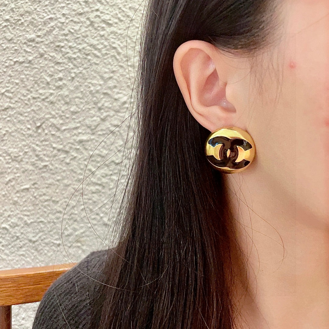 Martin Graham stud earrings in polished metal-tone – detail view