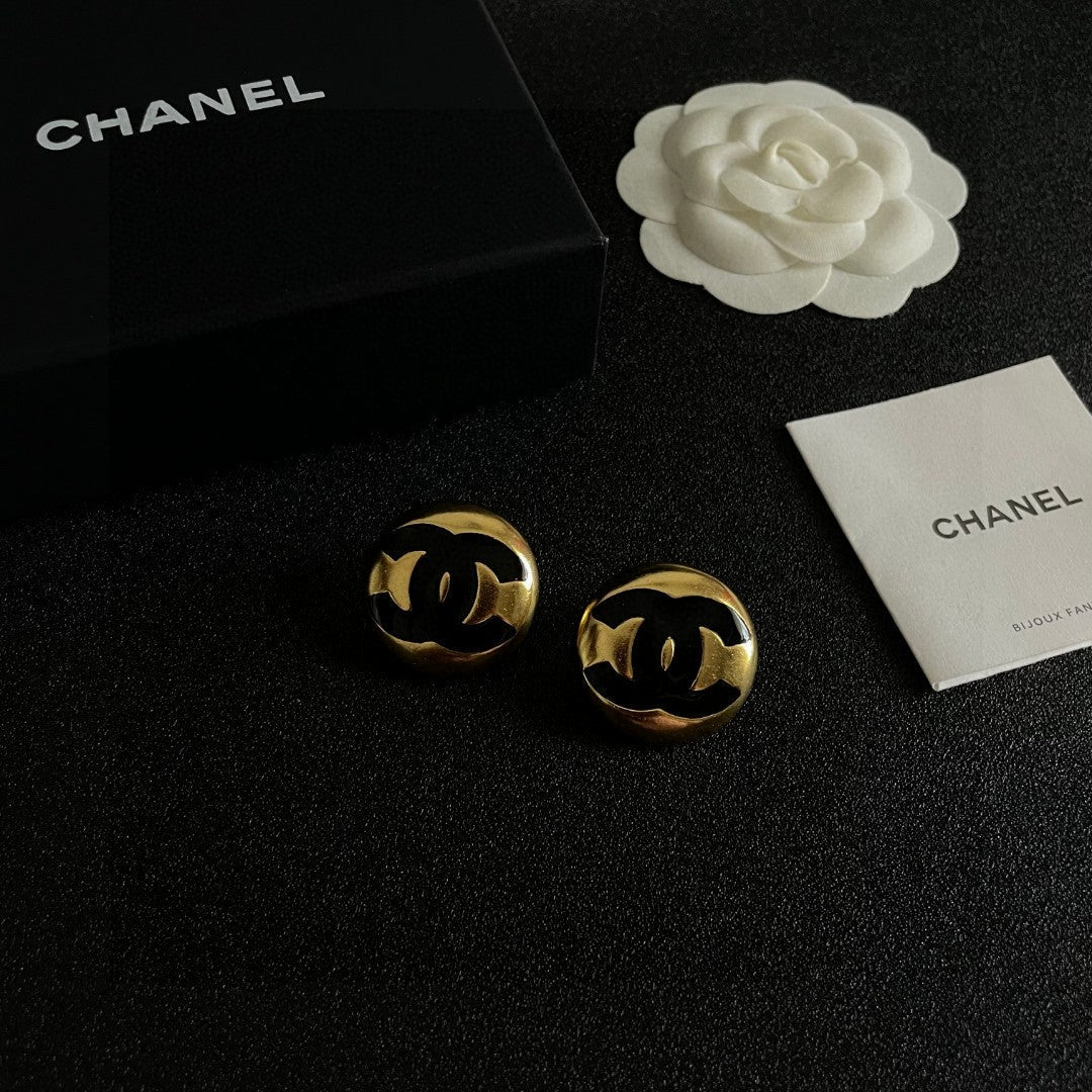 Martin Graham stud earrings in polished metal-tone – styled product view