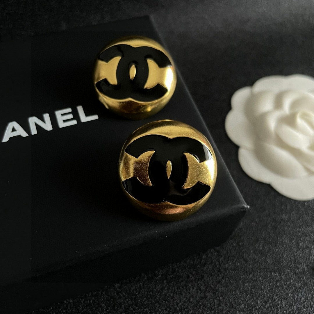 Martin Graham stud earrings in polished metal-tone – detail view