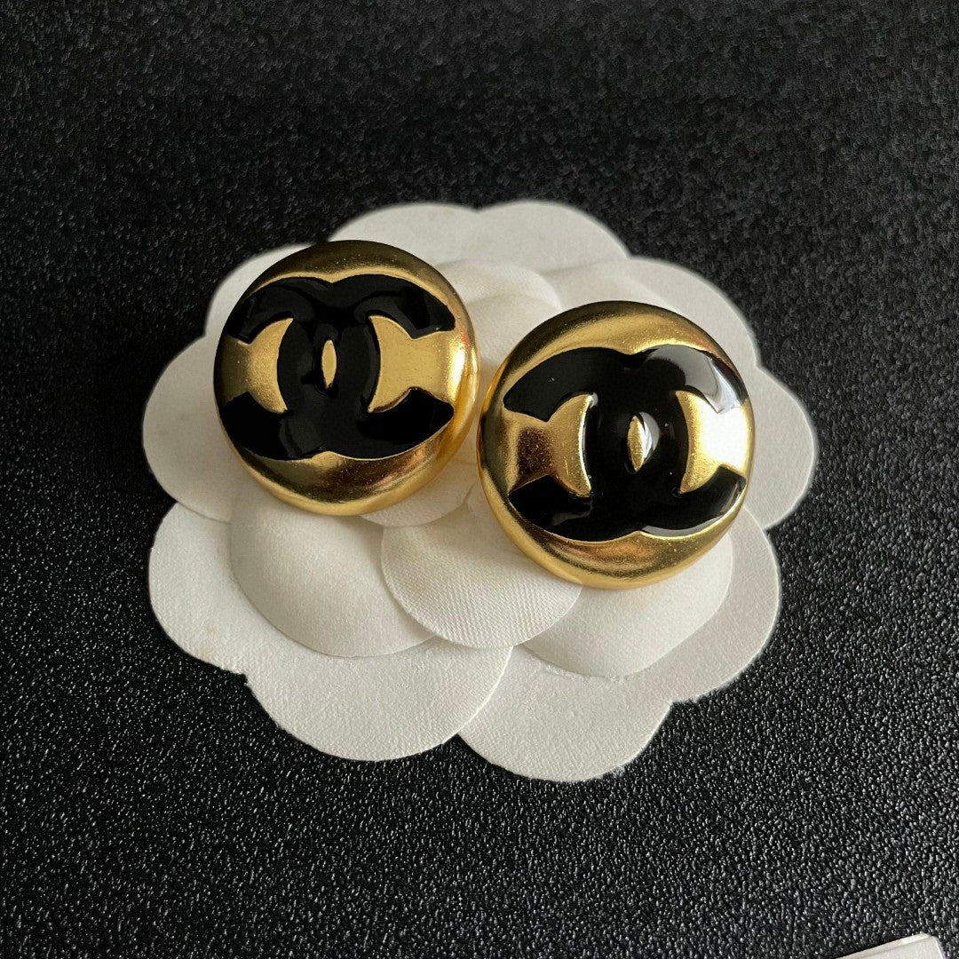 Martin Graham stud earrings in polished metal-tone – front product view
