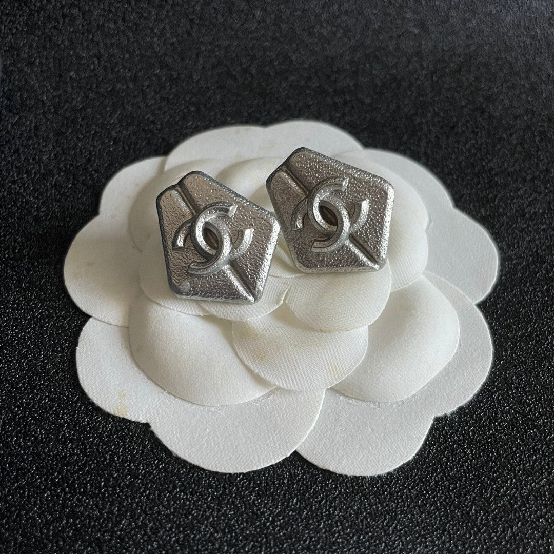 Martin Graham stud earrings in polished metal-tone – front product view