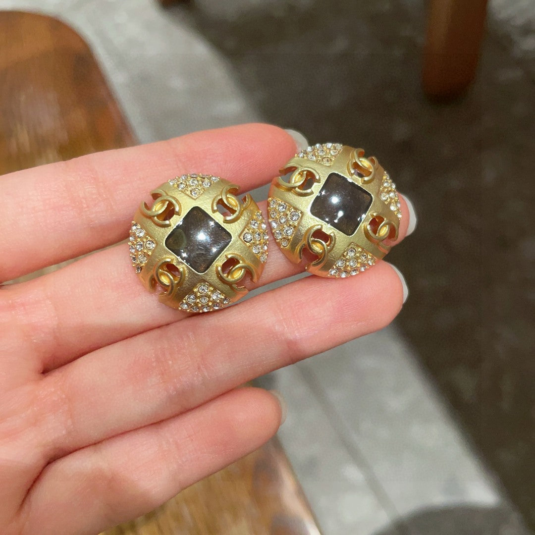 Martin Graham stud earrings in polished metal-tone – side detail