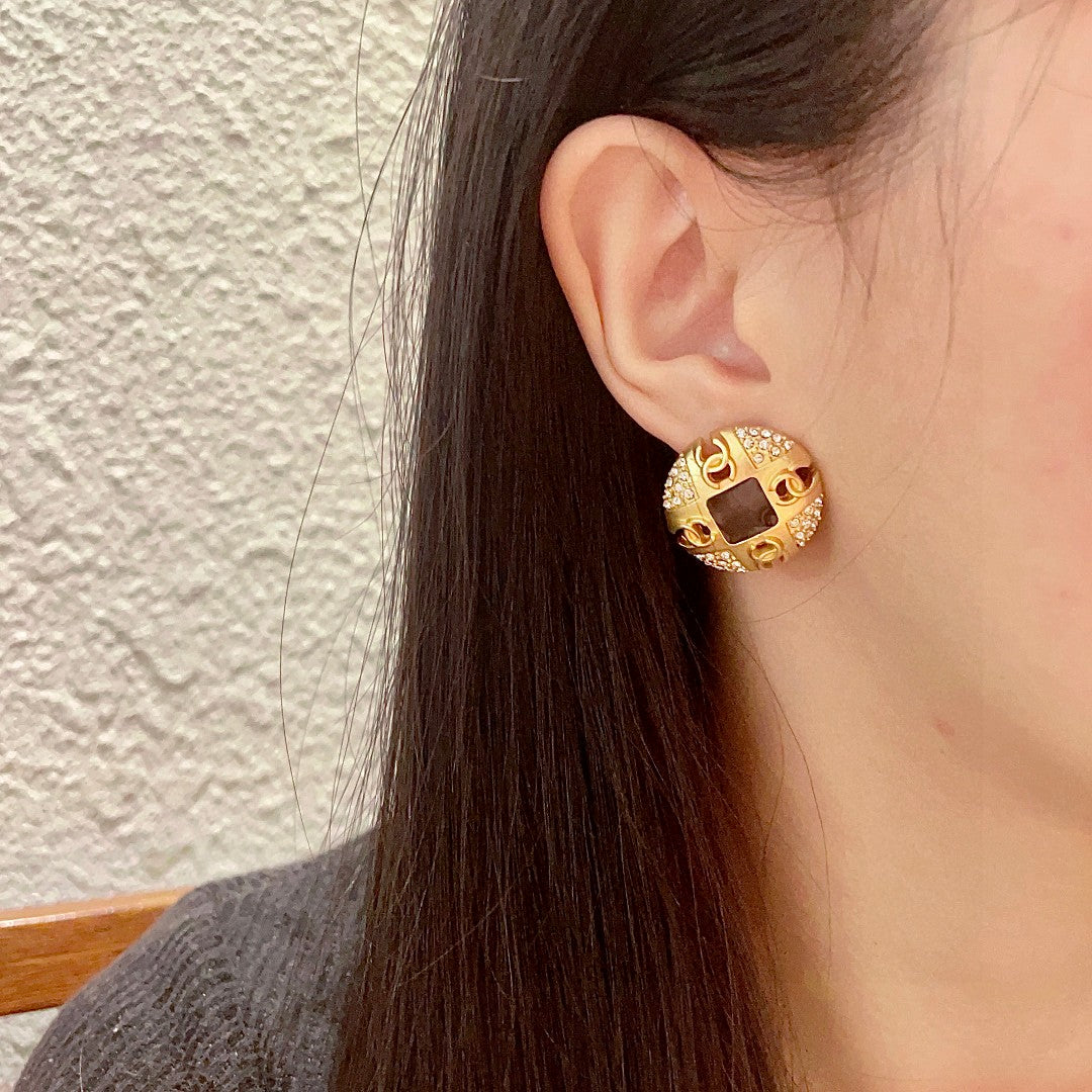 Martin Graham stud earrings in polished metal-tone – detail view