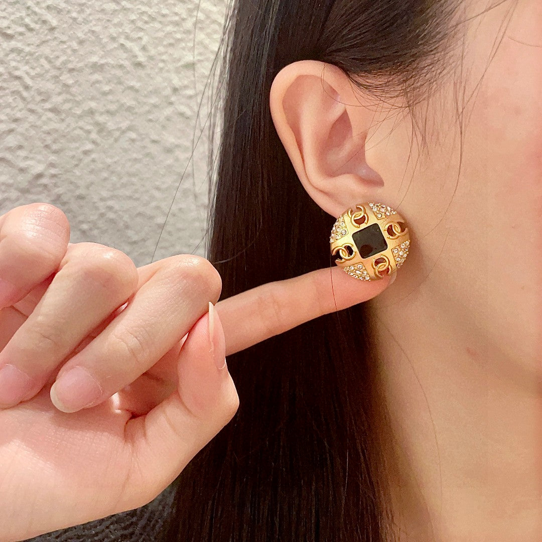 Martin Graham stud earrings in polished metal-tone – front product view