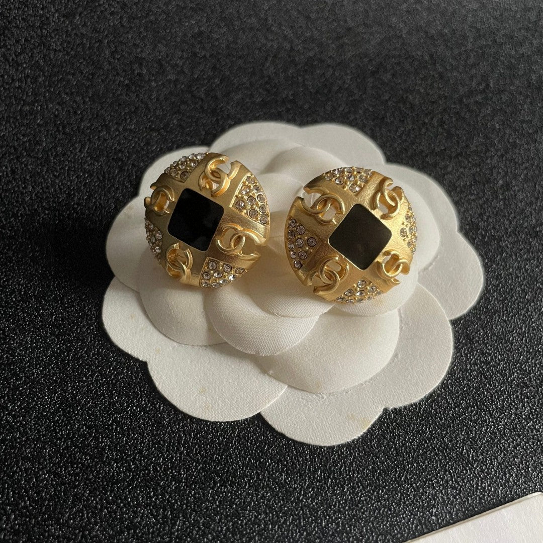 Martin Graham stud earrings in polished metal-tone – front product view