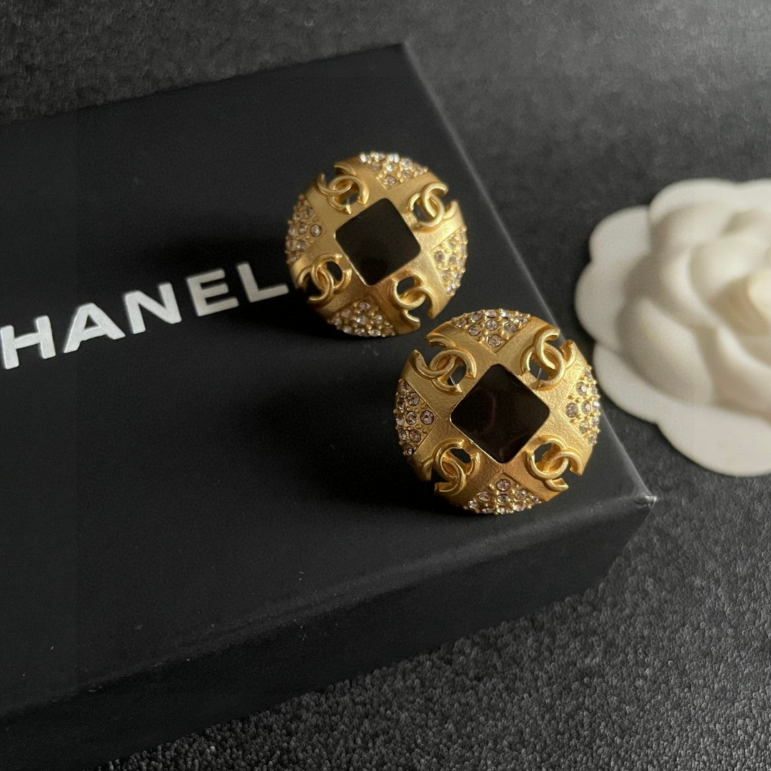 Martin Graham stud earrings in polished metal-tone – detail view