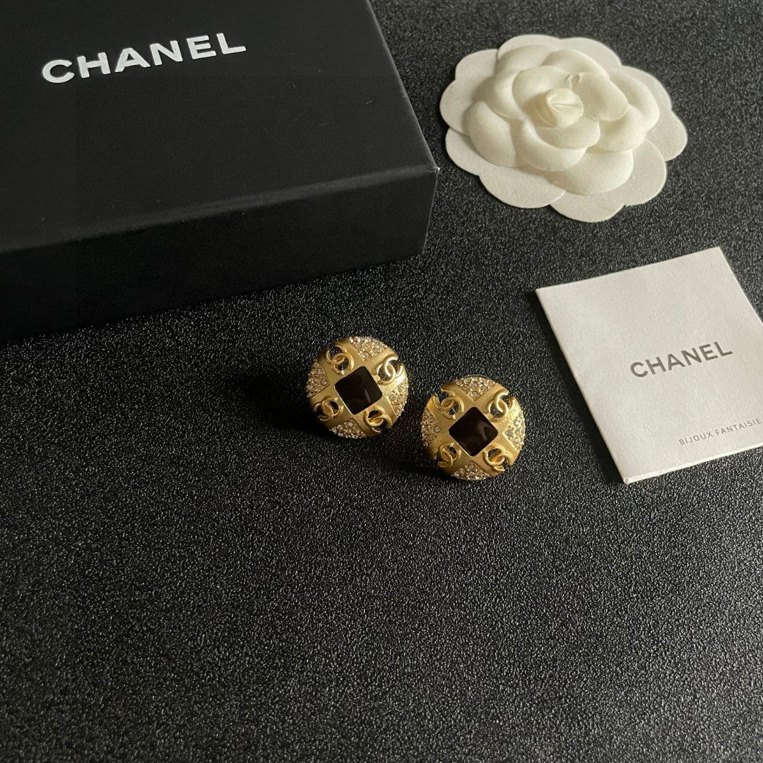 Martin Graham stud earrings in polished metal-tone – styled product view