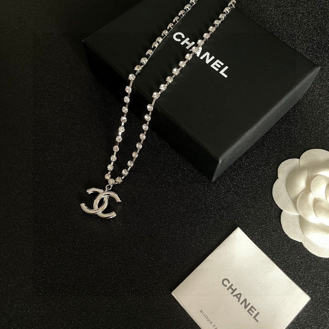 Martin Graham pendant necklace in polished metal-tone – close-up detail