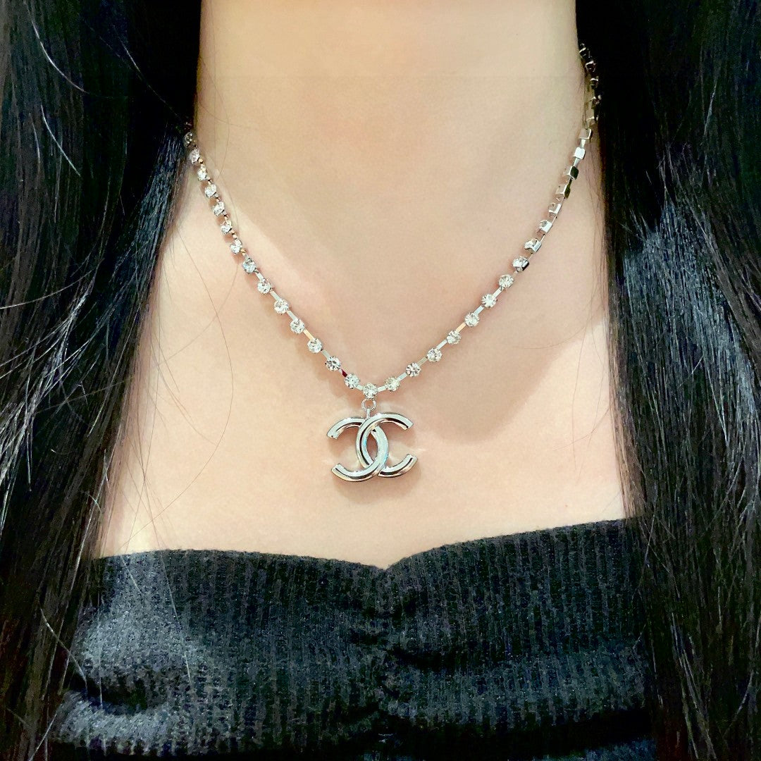 Martin Graham pendant necklace in polished metal-tone – detail view