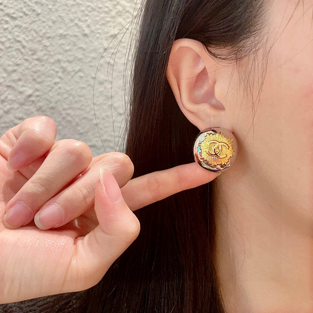Martin Graham stud earrings in polished metal-tone – front product view