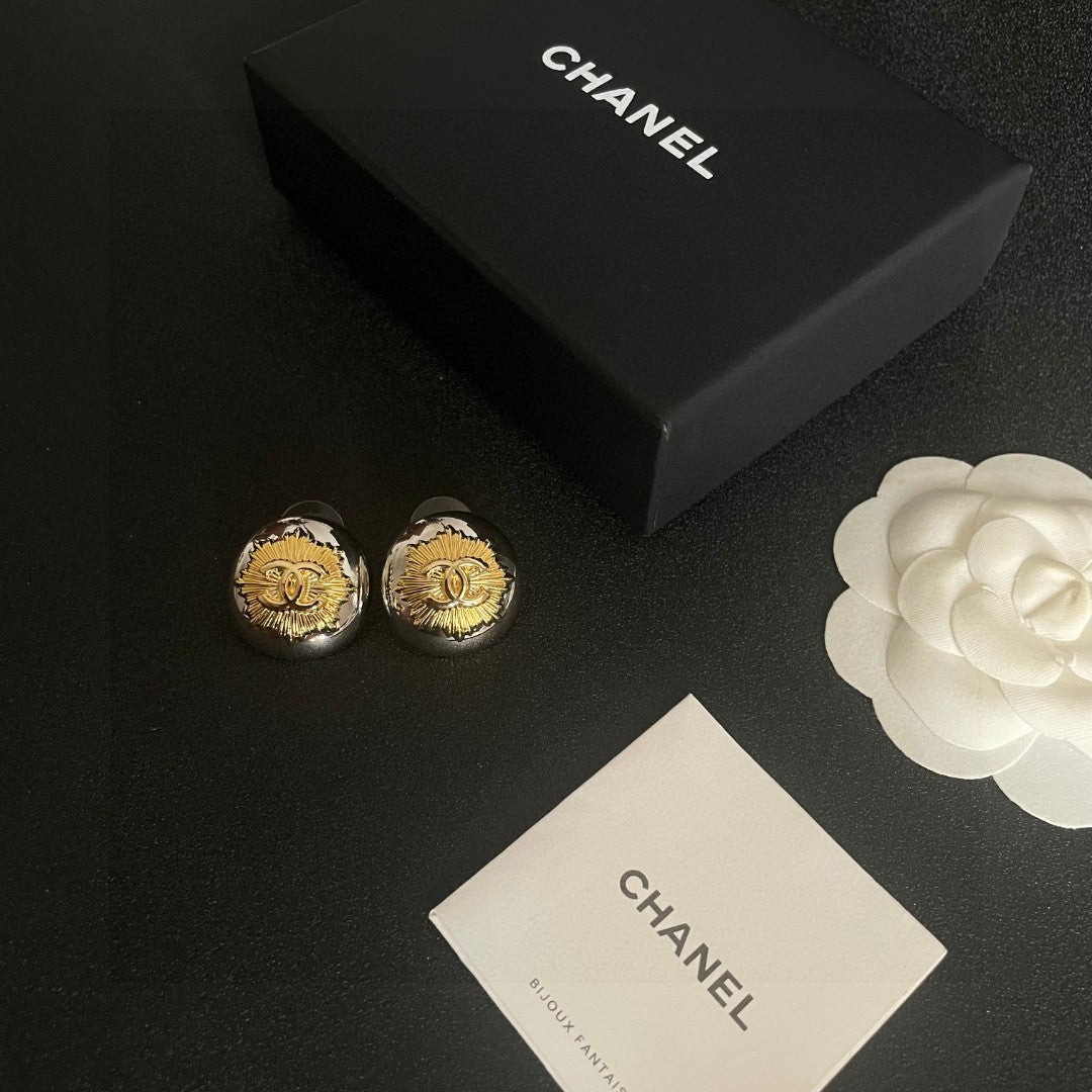 Martin Graham stud earrings in polished metal-tone – close-up detail