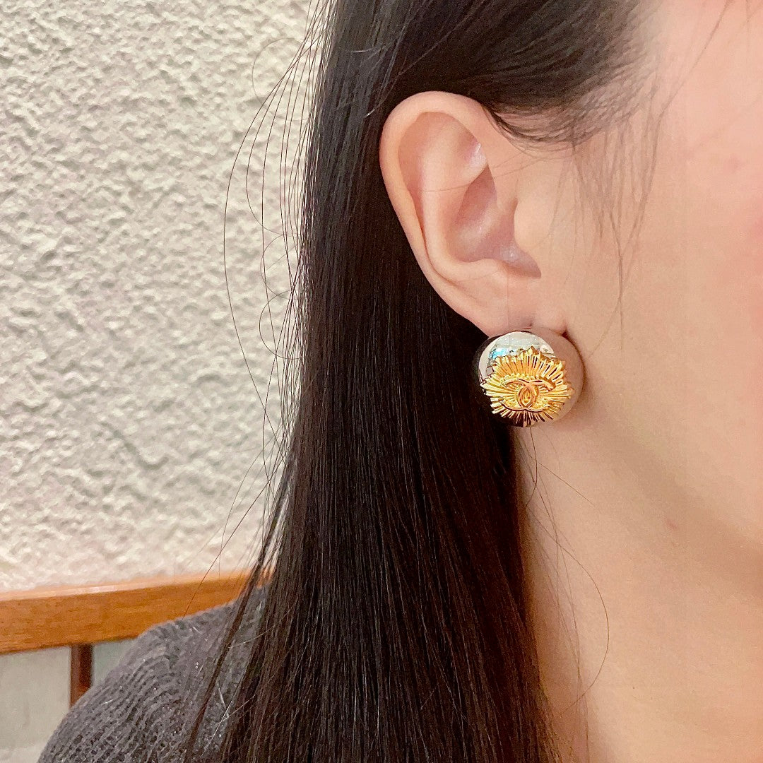 Martin Graham stud earrings in polished metal-tone – detail view