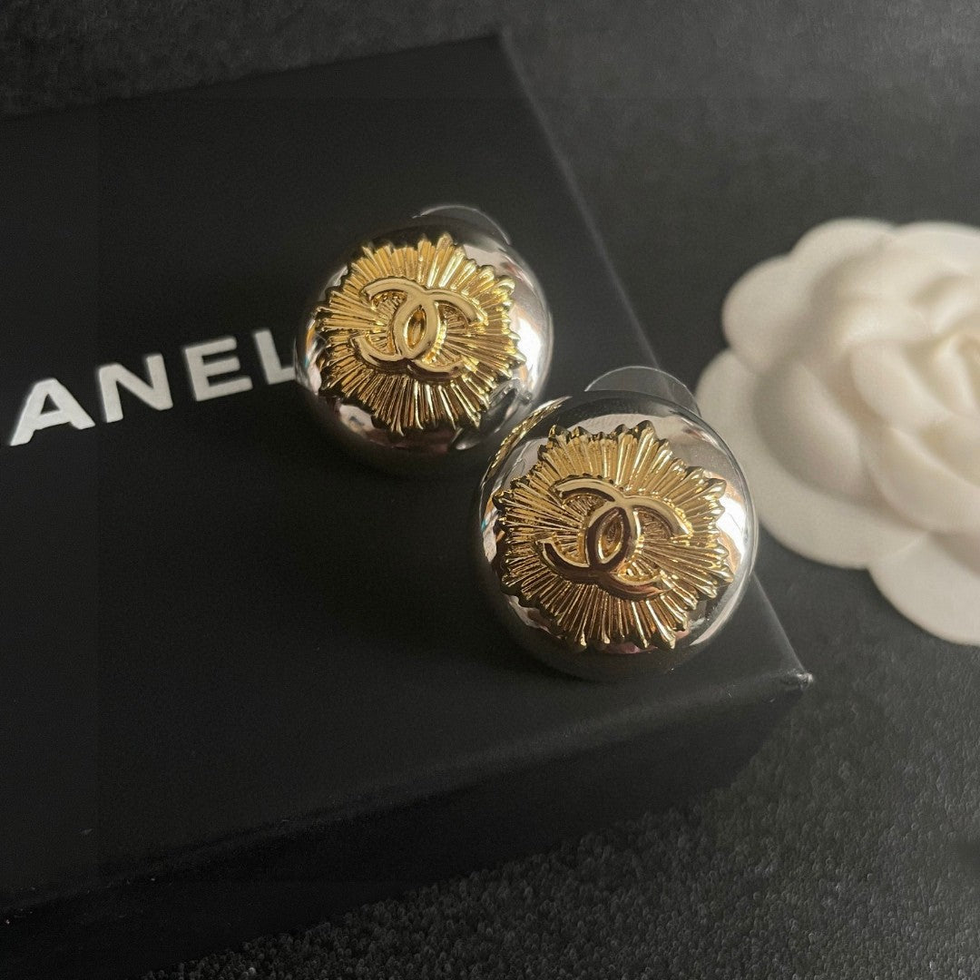 Martin Graham stud earrings in polished metal-tone – detail view
