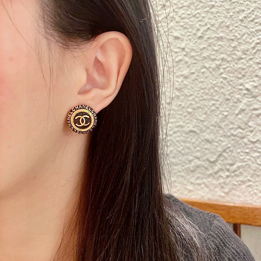 Martin Graham stud earrings in polished metal-tone – detail view
