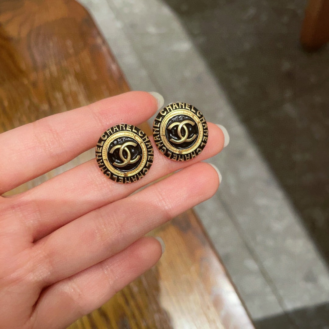 Martin Graham stud earrings in polished metal-tone – side detail