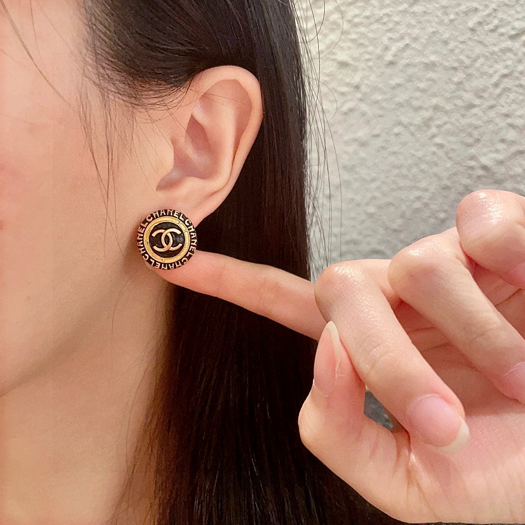 Martin Graham stud earrings in polished metal-tone – front product view