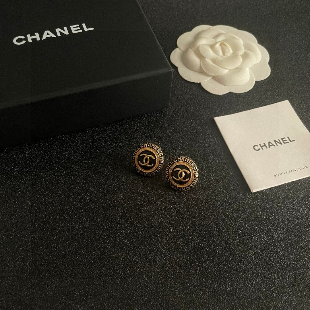 Martin Graham stud earrings in polished metal-tone – styled product view