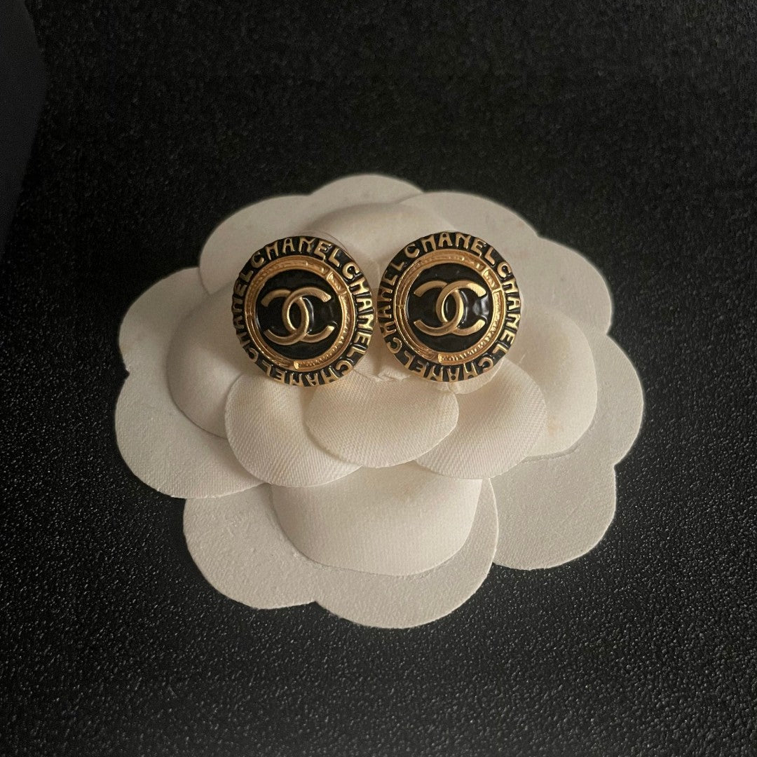 Martin Graham stud earrings in polished metal-tone – front product view