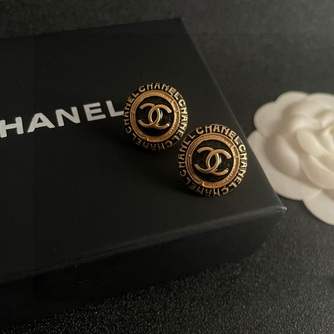 Martin Graham stud earrings in polished metal-tone – detail view