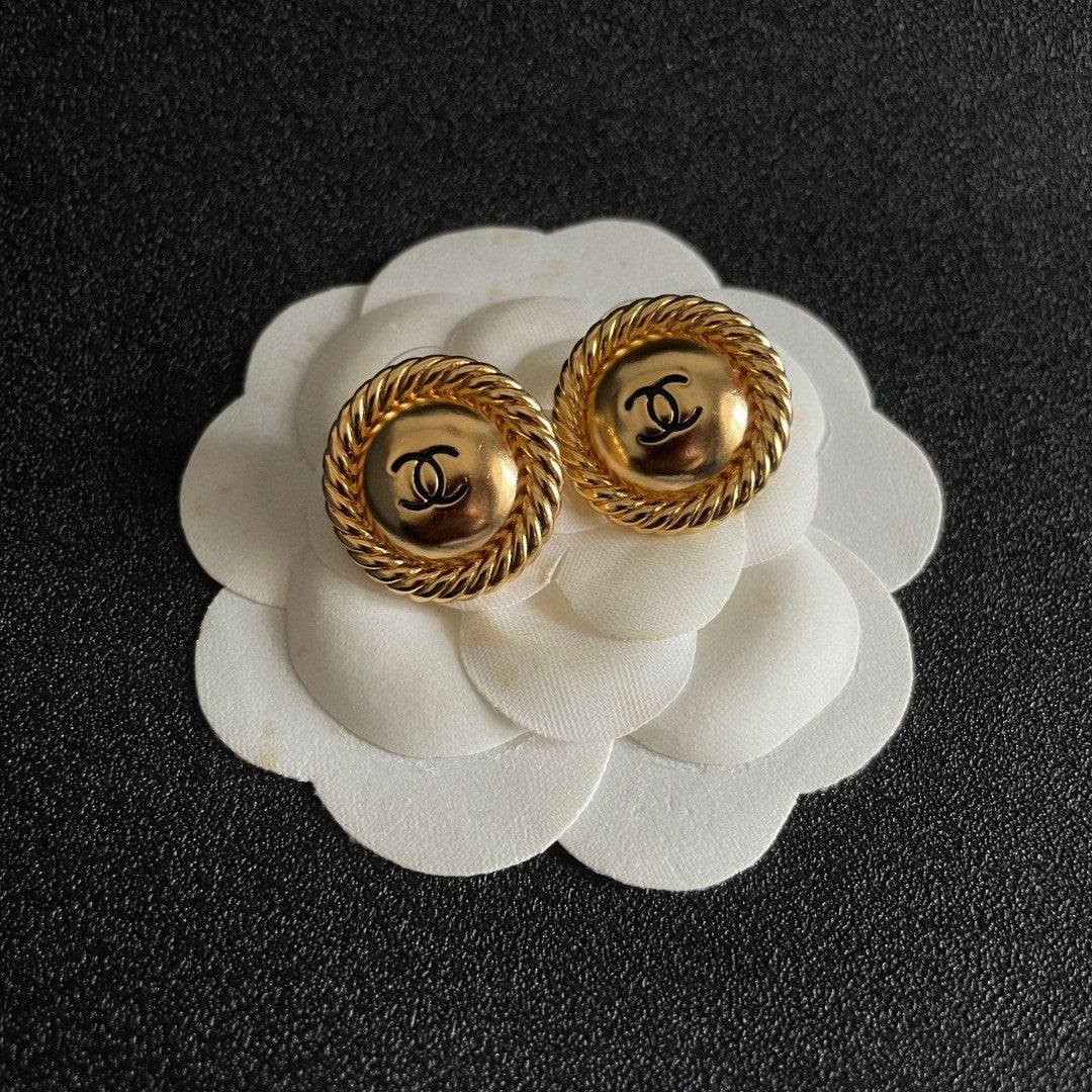 Martin Graham stud earrings in polished metal-tone – front product view