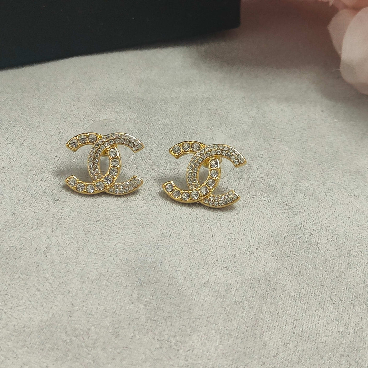 Martin Graham stud earrings in polished metal-tone – close-up detail