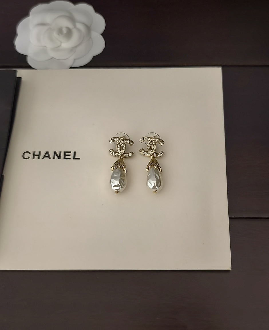 Martin Graham earrings in polished metal-tone – close-up detail