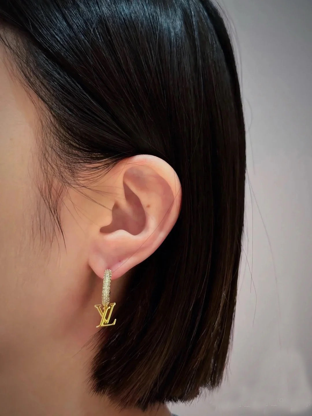 Martin Graham earrings in polished metal-tone – close-up detail