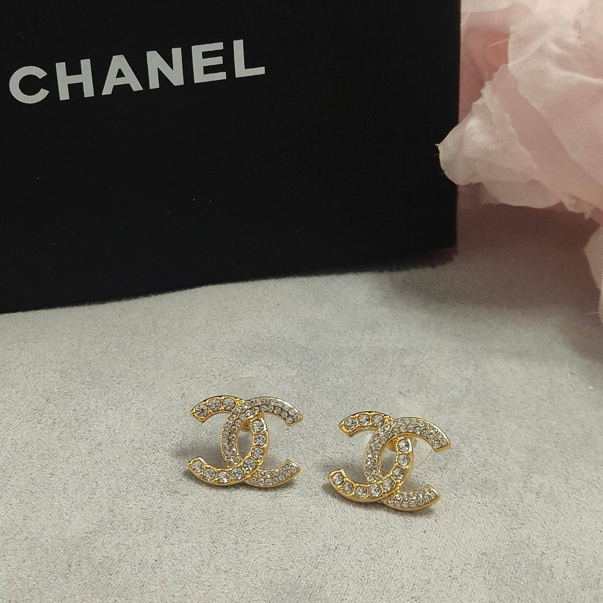 Martin Graham stud earrings in polished metal-tone – detail view