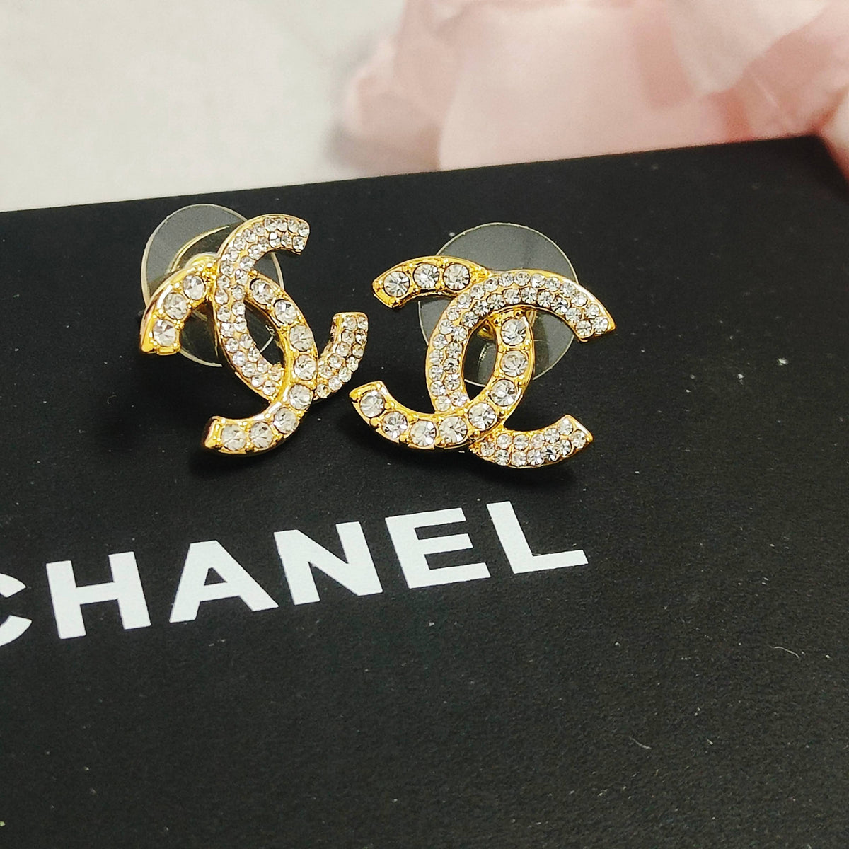Martin Graham stud earrings in polished metal-tone – detail view