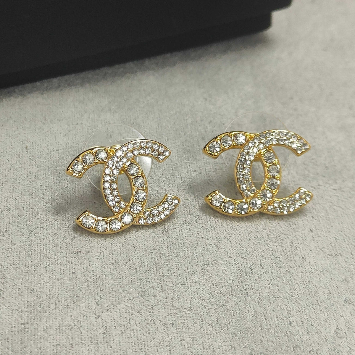 Martin Graham stud earrings in polished metal-tone – front product view